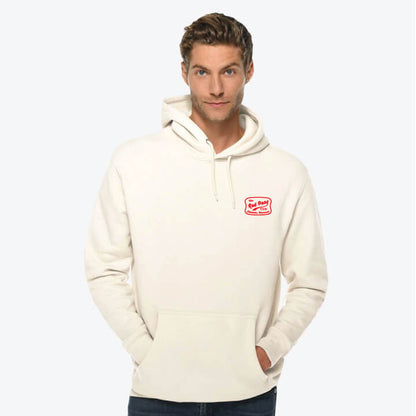 Man wearing a cream hoodie with a logo on a white background