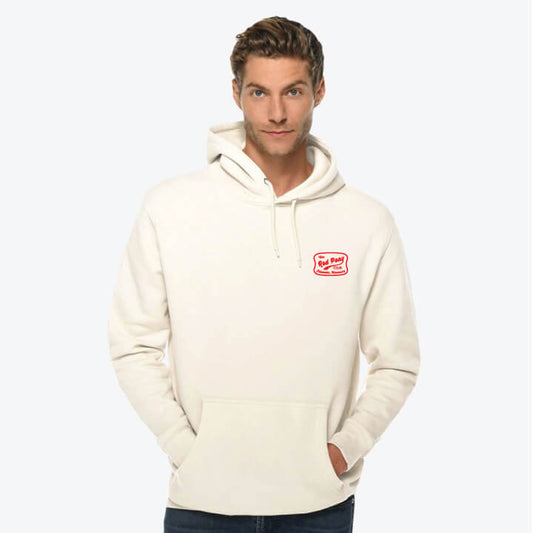 Man wearing a cream hoodie with a logo on a white background