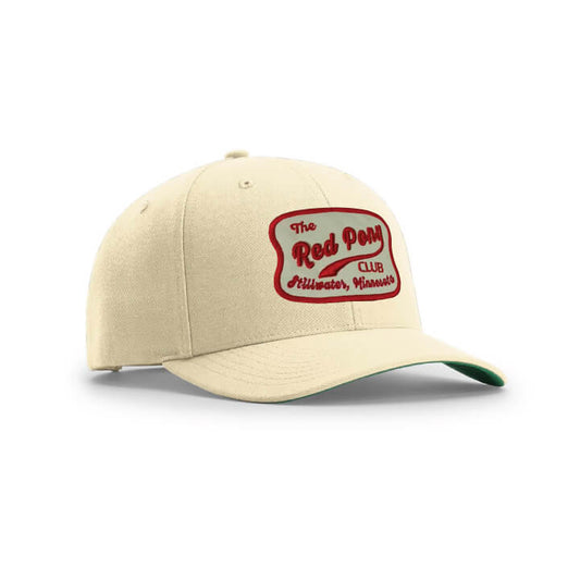 Beige cap with red and Tan logo on a white background