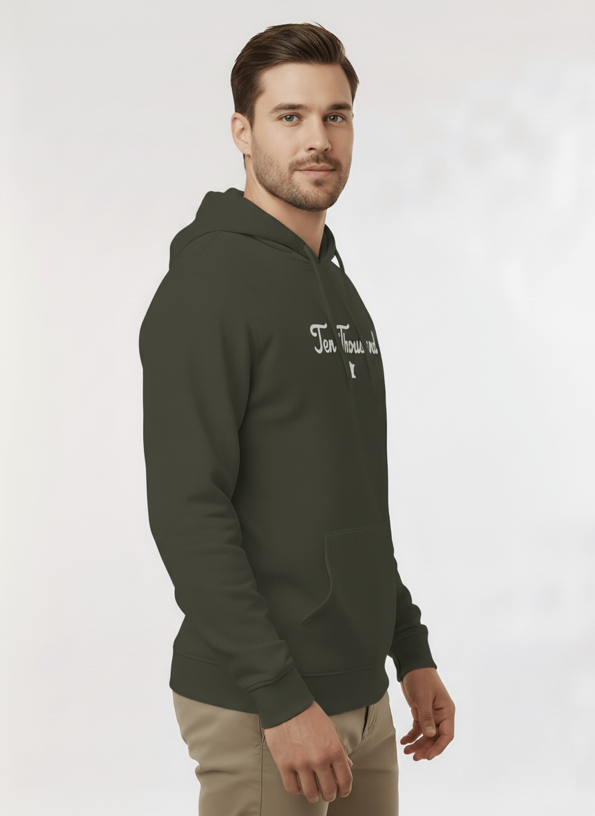 Man wearing a green hoodie with text on a white background