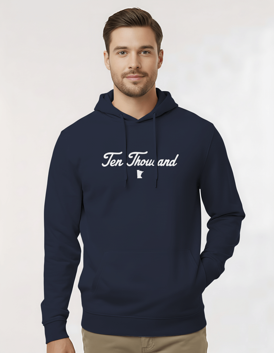 Man wearing a navy blue hoodie with 'Ten Thousand' text on a white background