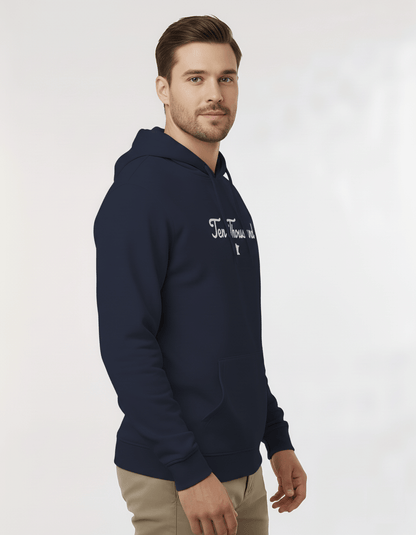Man wearing a navy hoodie with a brand logo on a light gray background